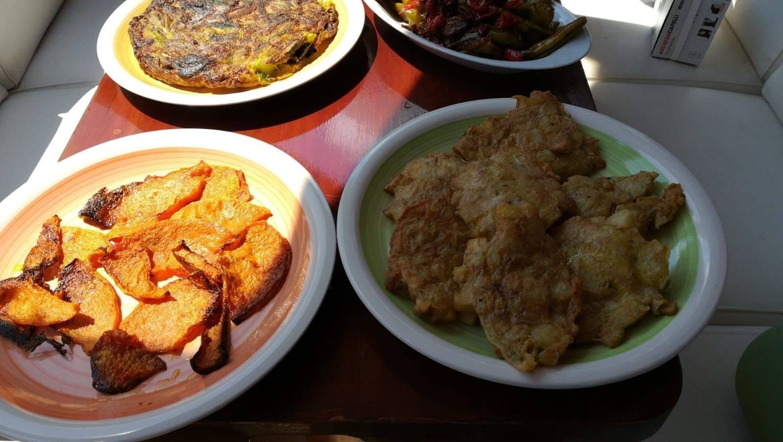 Home-cooked dishes laid out on the cockpit table